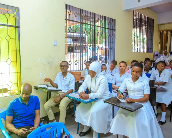 Students taking notes during the World Sickle Cell Day awareness campaign